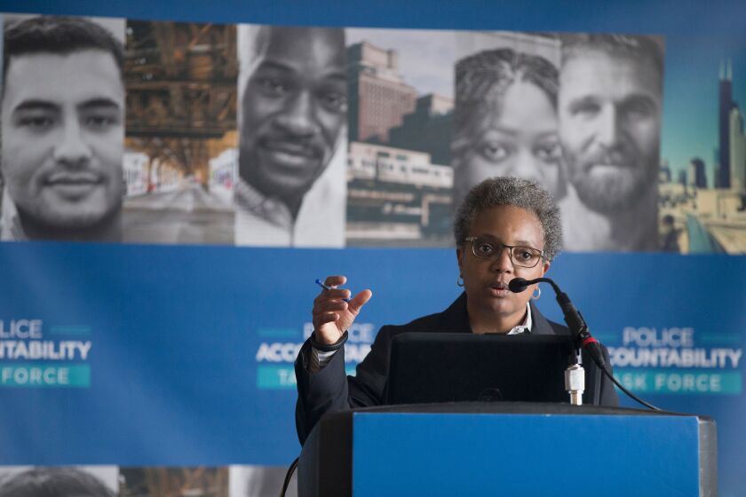 Lori Lightfoot, chair of the Chicago Police Board, addresses community leaders and members of the news media about the findings of the Police Accountability Task Force last month. | Scott Olson/Getty Images