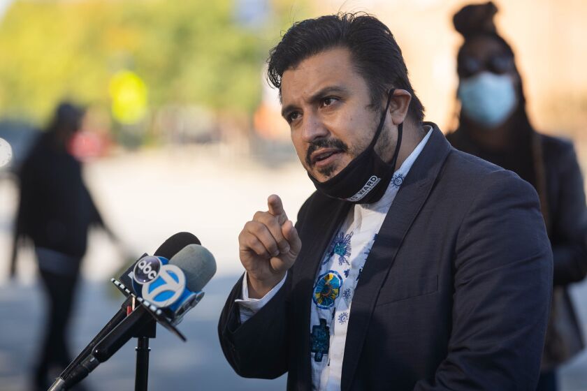 Ald. Byron Sigcho-Lopez speaking at a news conference