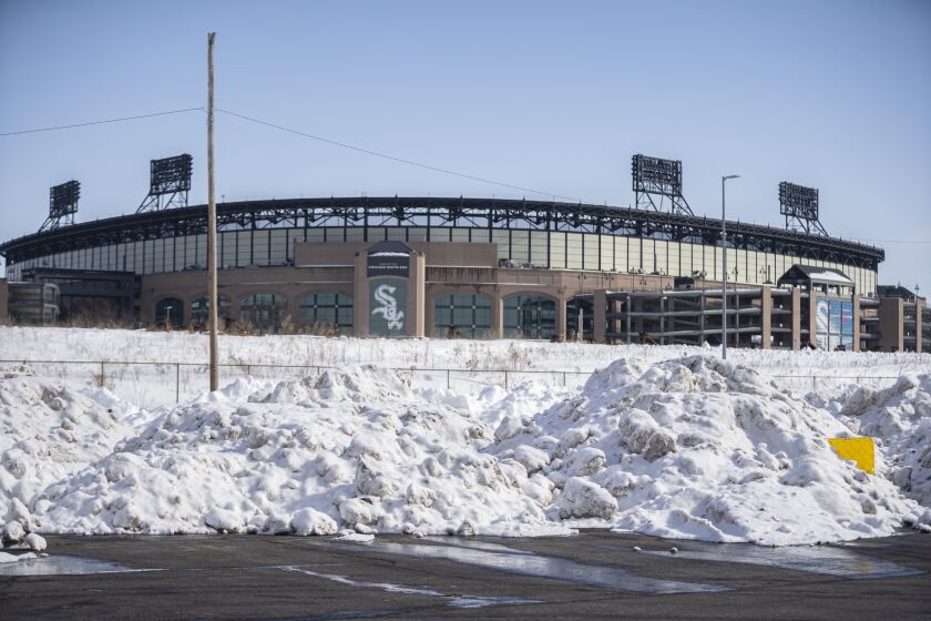 Piles of snow build up at Guaranteed Rate Field, home of the Chicago White Sox. The city is hauling snow there and also to other locations.