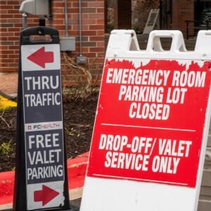 A sign indicating Edward Hospital’s emergency room parking lot is closed in Naperville, Friday March 20, 2020.