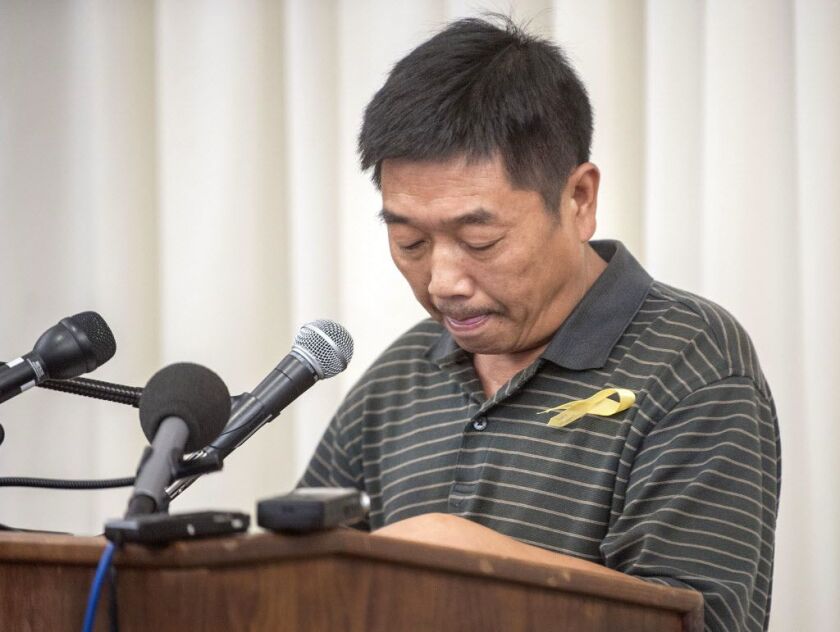 YingYing Zhang’s father, Ronggao Zhang, reads a letter he sent to President Donald Trump during a news conference at the I-Hotel in Urbana on Tuesday. | Rick Danzl/News-Gazette via AP