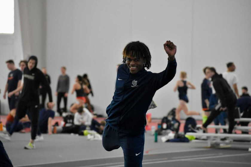 Marcus Jackson stretches at track practice