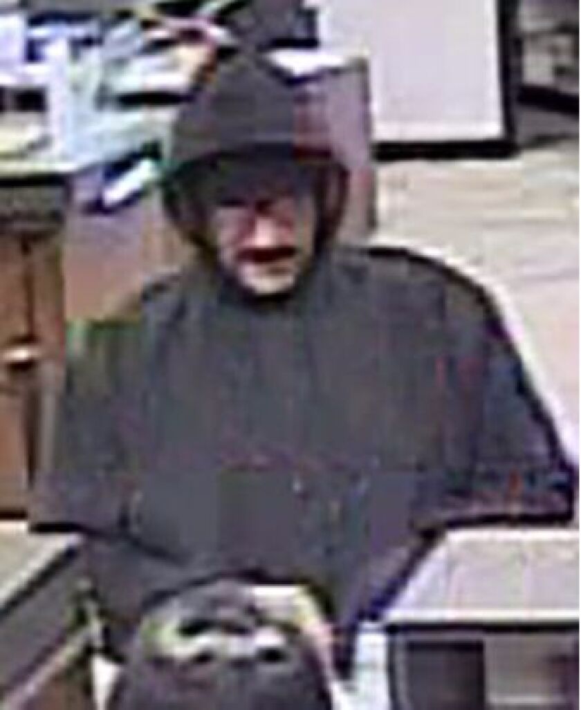 Surveillance image of the man suspected of robbing a bank in Skokie Friday morning. | Skokie police