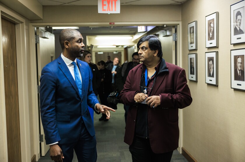 State Rep. La Shawn K. Ford (left) speaks with Resilience Healthcare CEO Manoj Prasad after a press conference Wednesday to discuss the conditions at West Suburban Medical Center in Oak Park.