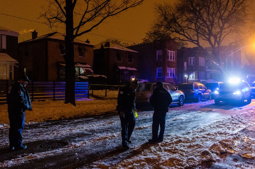 Police investigate the scene where 3 people were shot, Tuesday morning, in the 9000 block of South Bishop in the Brainerd neighborhood. | Tyler LaRiviere/Sun-Times