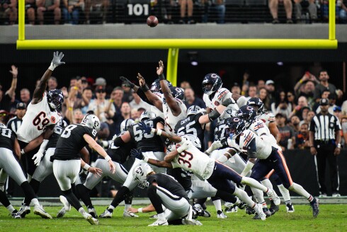 Las Vegas Raiders kicker Daniel Carlson tries to kick a field goal near the end of a game against the Bears Sunday, Sept. 28, 2025, in Las Vegas. The Bears' Josh Blackwell, No. 39, blocked the kick.