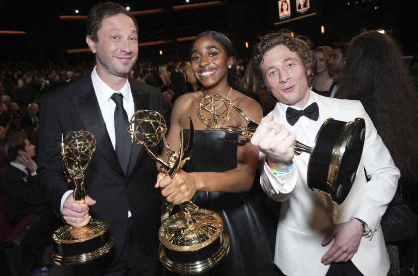 Ebon Moss-Bachrach, (from left), winner of the Emmy Award for outstanding supporting actor in a comedy series for "The Bear", Ayo Edebiri, winner of the Emmy Award for outstanding supporting actress in a comedy series for "The Bear", and Jeremy Allen White, winner of the Emmy Award for outstanding lead actor in a comedy series for "The Bear" at the 75th Emmy Awards on Monday, Jan. 15, 2024 at the Peacock Theater in Los Angeles. (Photo by Jordan Strauss/Invision for the Television Academy/AP Images)