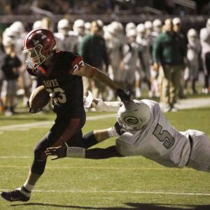 Maine South’s Dan Lazic (23) scores against Glenbard West’s Jayden Rodgers. Kevin Tanaka/For the Sun-Times.