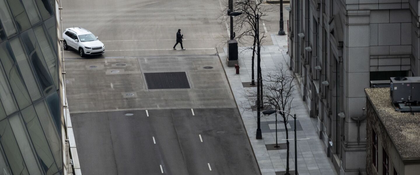 Amid fears of the coronavirus pandemic and a stay-at-home order from Gov. J.B. Pritzker, few pedestrians and minimal traffic could be seen in the Loop, looking north on North Clark Street from the roof of City Hall during what should have been the Wednesday morning commute, April 1, 2020.