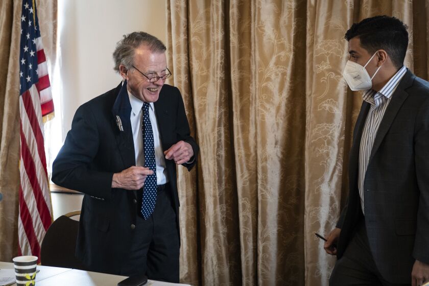 Illinois’ former Speaker of the House Mike Madigan laughs as he chats with State Rep. Aaron Ortiz after a committee hearing on the Southwest Side to decide who will take over as state representative in the 22nd House District seat, a position held by Madigan since 1971.
