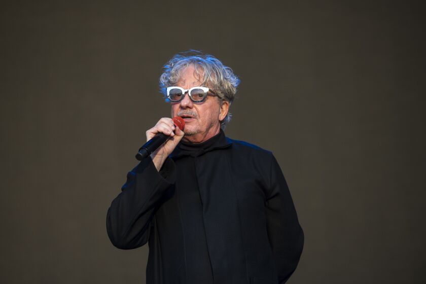 DEVO performs at the Riot Stage on day 4 of Riot Fest.