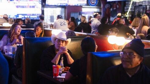 People watch the game between the University of Illinois and the University of Connecticut’s basketball teams at Mullen’s Sports Bar and Grill.