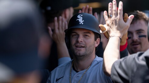Andrew Benintendi celebrates after hitting a three-run home run Saturday against the A's.