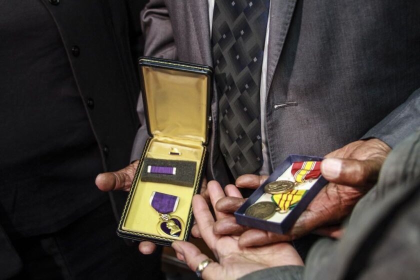 Harold J. Walker’s Purple Heart and other military medals were in a safe deposit box when the bank closed. The Illinois treasurer’s office returned them to Walker on Wednesday. | Maria Cardona/ Sun-Times