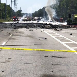 Emergency personnel work at the scene of a military cargo plane crash. | Chris Hanks/Savannah Professional Firefighters Association via AP