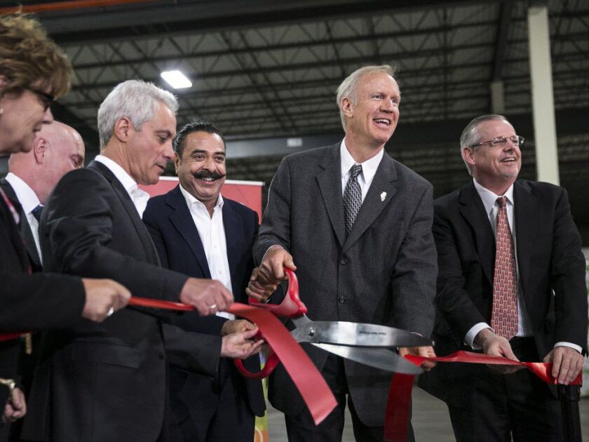 Mayor Rahm Emanuel and Gov. Bruce Rauner join Shahid Khan, owner of auto parts manufacturer Flex-N-Gate, for a ribbon-cutting ceremony last year. File Photo. | Ashlee Rezin/Sun-Times
