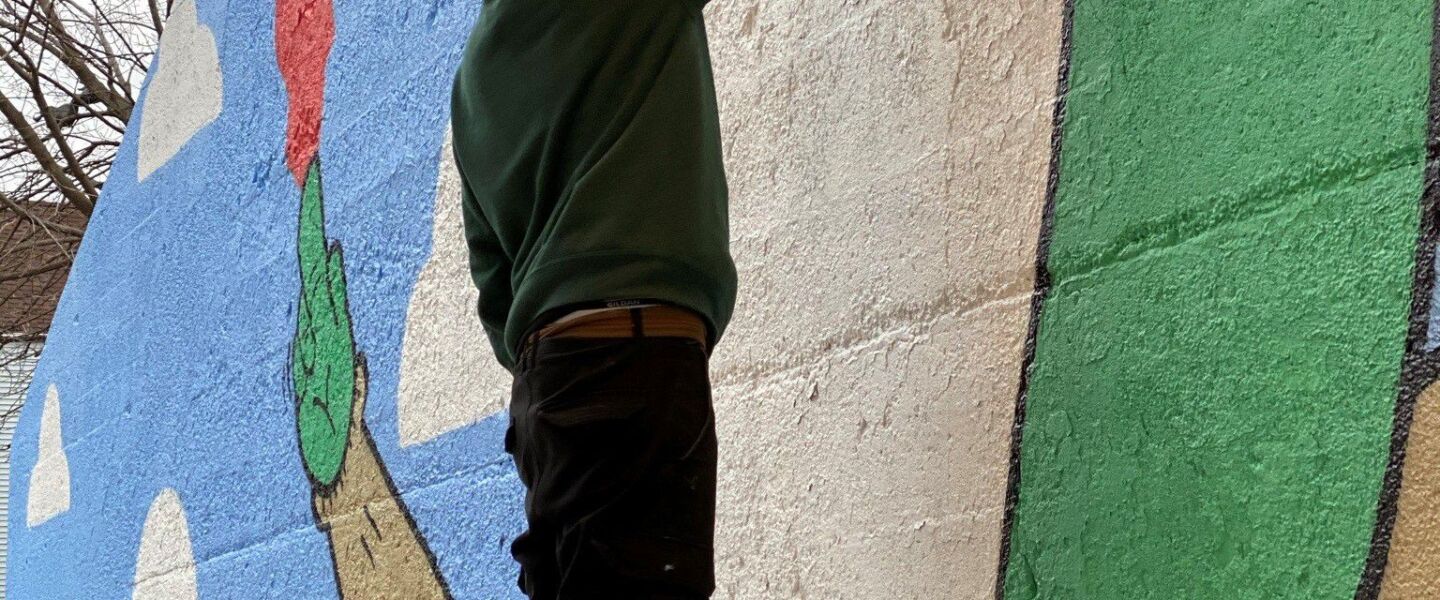Muralist Manny Gomez’s signature character is an alien — which he says is an artistic take on the way some people see Mexican people as illegal aliens.