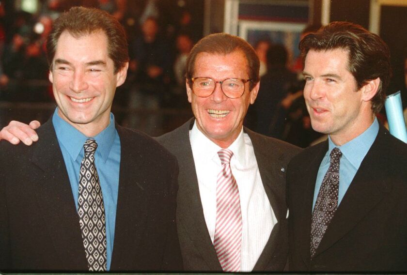 Three actors who played James Bond, Timothy Dalton, left, Roger Moore, center, and Pierce Brosnan in November 1996. | AP file photo