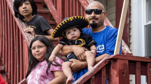 Spectators watch the 20th annual Mexican Independence Day Parade along West 18th Street in the Pilsen neighborhood, Saturday afternoon, Sept. 10, 2022.