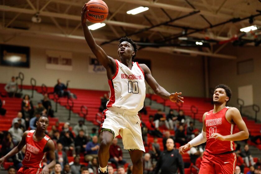 Bolingbrook’s Darius Burford (10) shoots the ball over Homewood-Flossmoor.