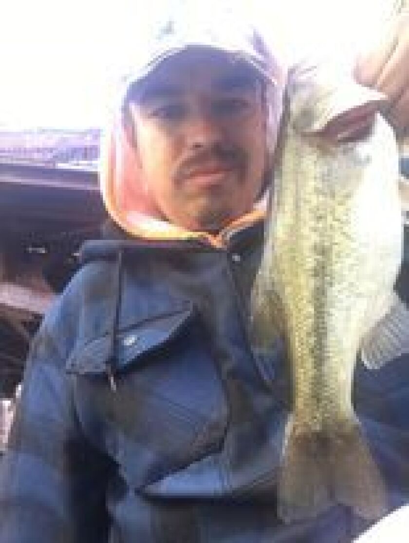 Jeffrey Williams with a largemouth bass from the Chicago River. Provided photo