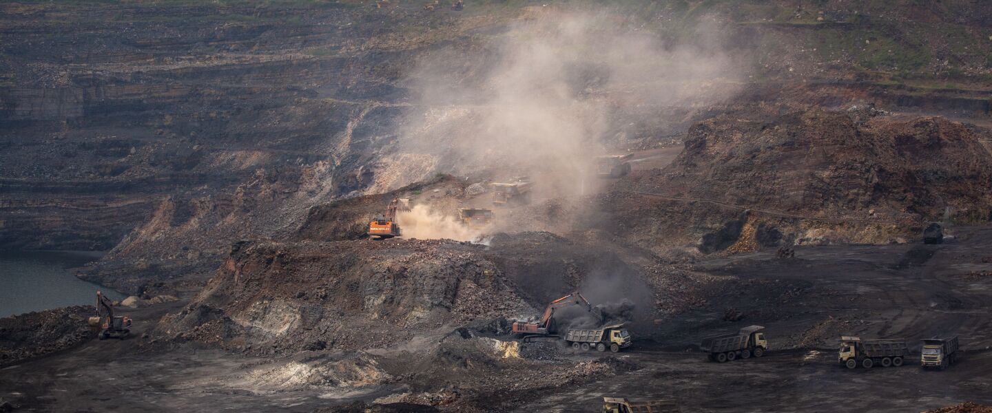 Mining in progress at an open-cast mine near Dhanbad, an eastern Indian city in Jharkhand state.