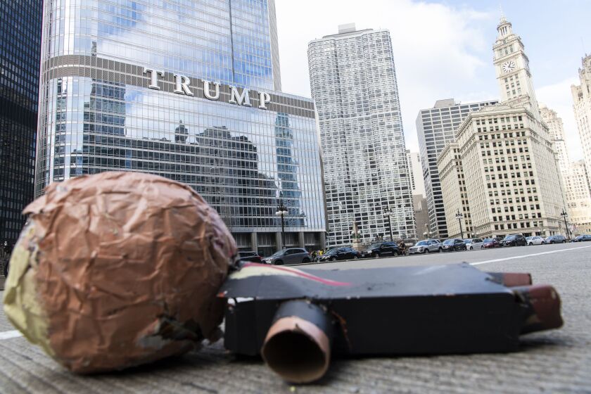An broken effigy of President Donald Trump lays on Wacker Drive at a “stop the steal” protest on Thursday, Nov. 26, 2020.