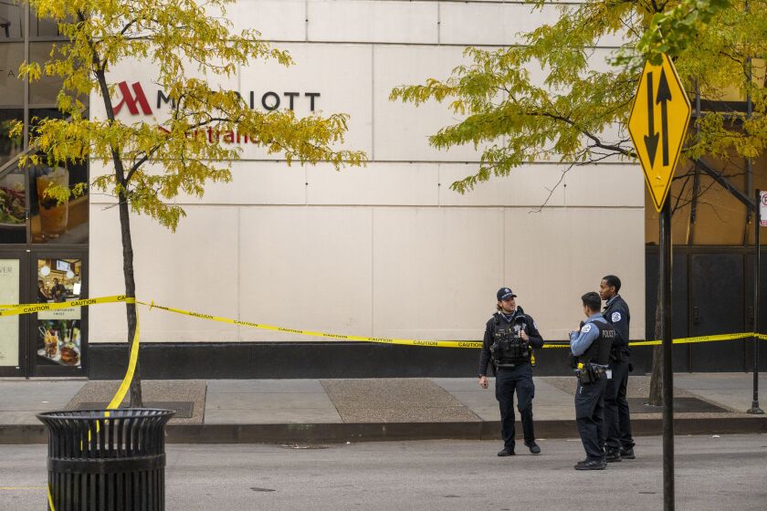 Chicago police work the scene where a 37-year-old man was shot near the Chicago Marriott Downtown Magnificent Mile hotel in the 500 block of N. Rush St. in the River North neighborhood, Monday, Oct. 23, 2023.