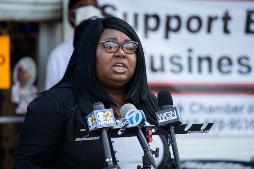 Siri Hibbler, CEO of the Garfield Park Chamber of Commerce, condemns the closure of One-Eleven Food and Liquors during a news conference outside the store in East Garfield Park Thursday morning, Aug. 13, 2020. Community advocates and residents demanded that the store’s license be reinstated.