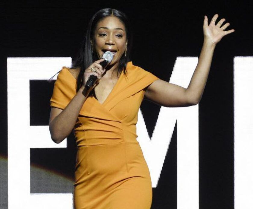 Tiffany Haddish, a cast member in an untitled upcoming movie directed by Tyler Perry, waves to the crowd as she exits the stage during the Paramount Pictures presentation at CinemaCon 2018, on Wednesday, April 25, 2018, in Las Vegas. | Chris Pizzello/Invi