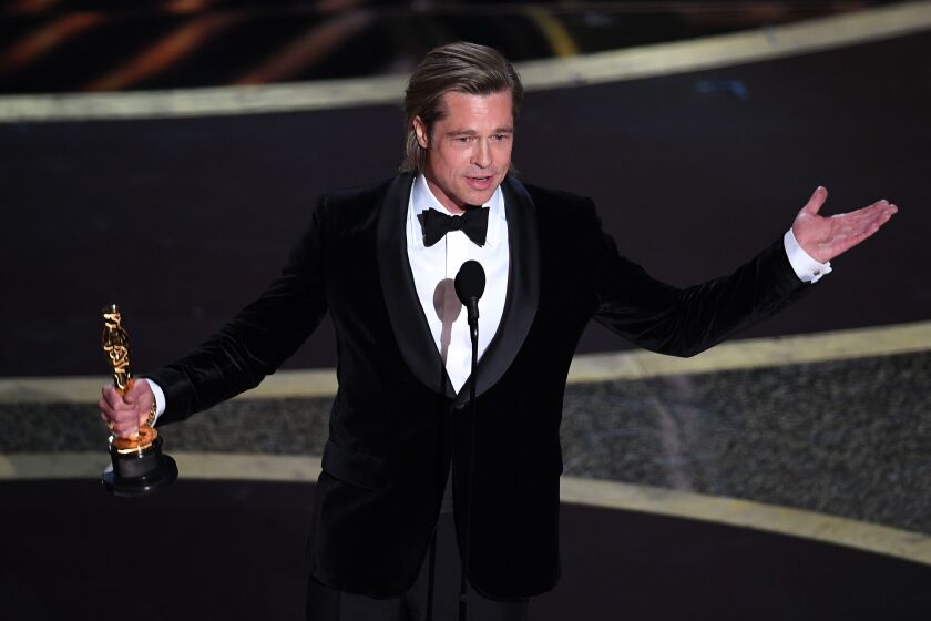 Brad Pitt accepts the Oscar for best actor in a supporting role for ‘Once Upon a Time in Hollywood’ onstage during the 92nd Annual Academy Awards on Sunday night.