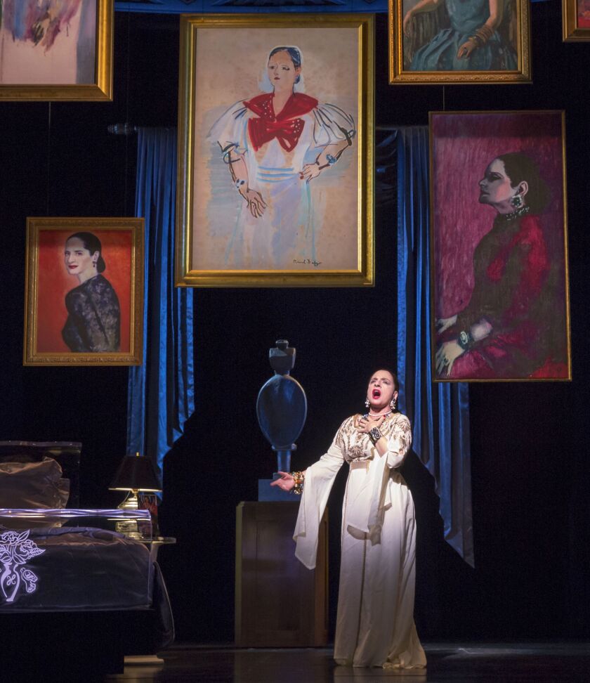 Patti LuPone (as cosmetics mogul Helena Rubinstein) is surrounded by portraits in “War Paint,” the world premiere musical at the Goodman Theatre. (Photo: Joan Marcus)