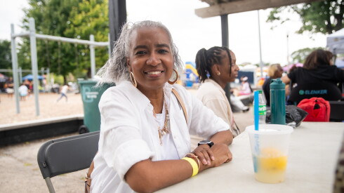 Denise Moore sits by the playground during Black and Bronze Music Fest in Armstrong Park on Saturday, August 29, 2026.