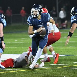 Nazareth’s J.J McCarthy (2) tries to find a receiver. Worsom Robinson/For the Sun-Times.