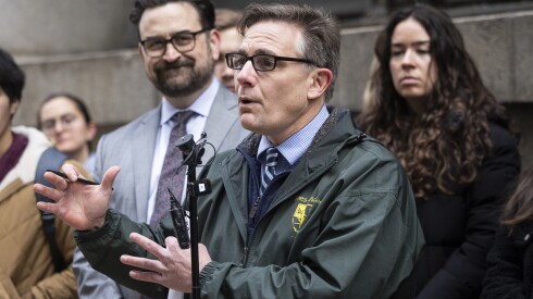 Jim Chilsen, of the Citizens Utility Board, speaks while Abe Scarr, of Illinois PIRG, stands behind him during a news conference outside City Hall in the Loop to advocate against a People's Gas rate hike, Tuesday, March 3, 2026.