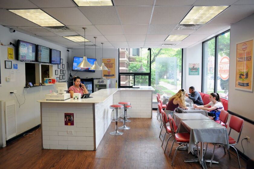 Diners eat inside Mikkey’s Retro Grill, retro-style eatery featuring classic American fare such as cheeseburgers, shakes, wings and fries. | Victor Hilitski/For the Sun-Times