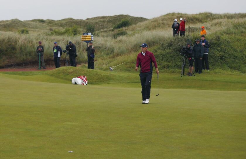 Jordan Spieth of the United States putts a birdie on the 11th hole during the second round of the British Open Golf Championship. | Alastair Grant/Associated Press