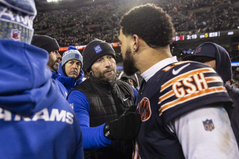 Los Angeles Rams head coach Sean McVay speaks to Chicago Bears quarterback Caleb Williams after the Bears lost 20 - 17 to the Rams in an NFC Divisional Round playoff game at Soldier Field on Sunday.