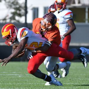 Back of the Yards’ Eddie Ramirez (6) brings down North Lawndale’s Rajuan Jones (22). Worsom Robinson/For the Sun-Times.