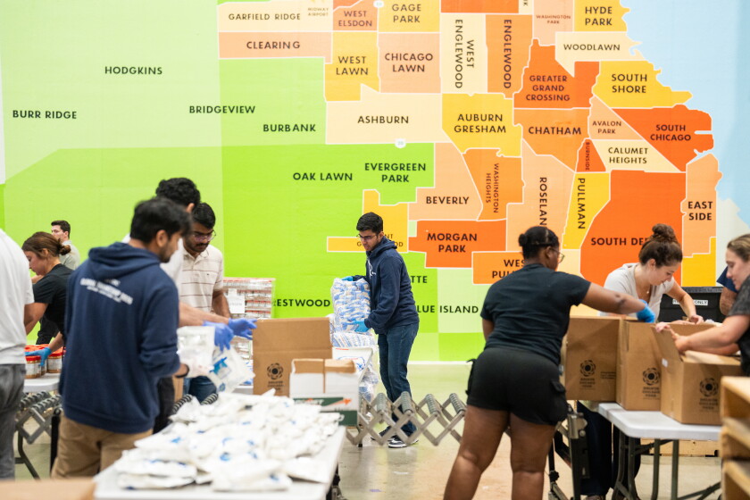 Volunteers help pack food at the Greater Chicago Food Depository warehouse in Archer Heights on Friday, September 11, 2026.