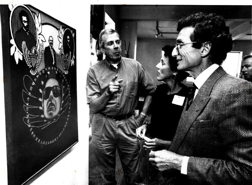Artist Ed Paschke (left) discussed his painting ‘Memorial’ with Susan and Lewis Manilow at a reception to announce a fall benefit for the School of the Art Institute of Chicago. | Sun-Times files