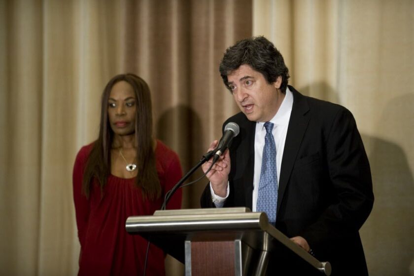 <small><strong> Family attorney Mark Bogen talks while Liz Banks, wife of baseball legend Ernie Banks stands behind him. | Richard A. Chapman/Sun-Times</strong></small>