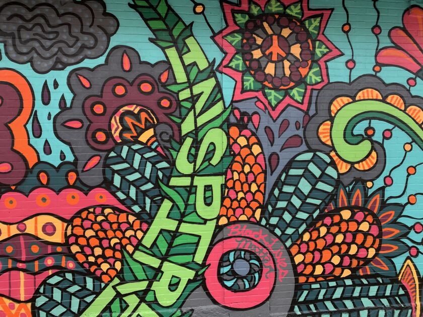 “Inspire” is spelled out in big letters in this Rogers Park mural.