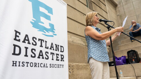 Barbara Decker Wachholz, a co-founder of the Eastland Disaster Historical Society, speaks during a ceremony commemorating those who perished in the S.S. Eastland disaster. Her grandmother was on the ship, but survived. The event was held along the Chicago Riverwalk near the Clark Street bridge on Friday, July 24, 2026.