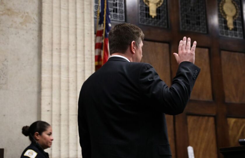 Chicago Police Officer Jason Van Dyke is sworn in before testifying in at a hearing Wednesday June 28, 2017 in front of Judge Vincent Gaughan at the Leighton Criminal Courts Building in Chicago. | Nancy Stone |Pool|Chicago Tribune
