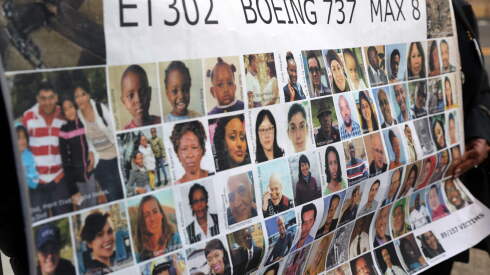 Victims of the Boeing 737 MAX crash in Ethiopia are shown on a placard outside a court hearing in Texas in 2023.