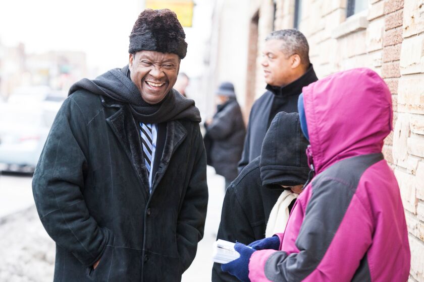 Mayoral candidate Willie Wilson talks with supporters outside a polling station in the Austin neighborhood on election day, Tuesday, February 24th. | James Foster / for Sun-Times Media