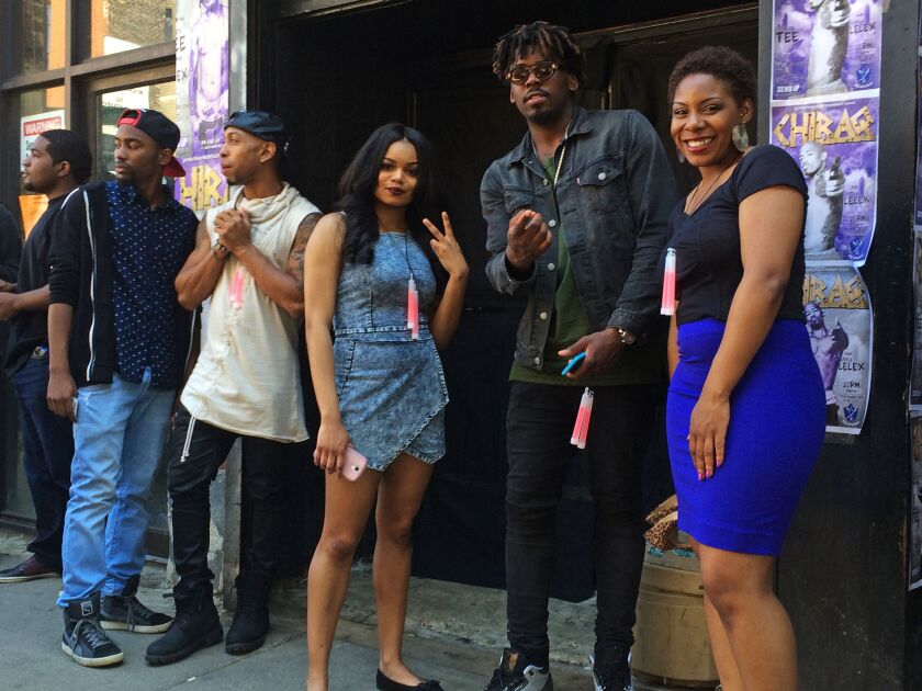 <small><strong>Extras waiting on Damen Avenue for a scene to be filmed on Spike Lee’s “Chiraq.” | Stefano Esposito/ Sun-Times</strong></small>