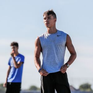 Plainfield South’s Niko Schultz listens to instructions during warm ups at the start of practice.