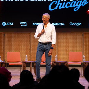Former President Barak Obama surprises a group of high school freshman girls Friday during the WNBA Changemaker Day at the Obama Presidential Center in Jackson Park on the South Side.